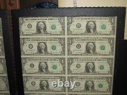 Lot de 2 feuilles non découpées de 16 billets d'un dollar de 1981 non circulés.