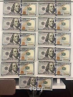 Onze billets de cent dollars américains de 2017 avec des numéros de série consécutifs.